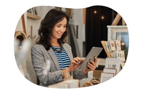 Small business owner looking for insurance quotes on their tablet. Small business owner looking for insurance quotes on their tablet.