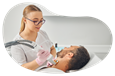 Medical spa employee treating a client.